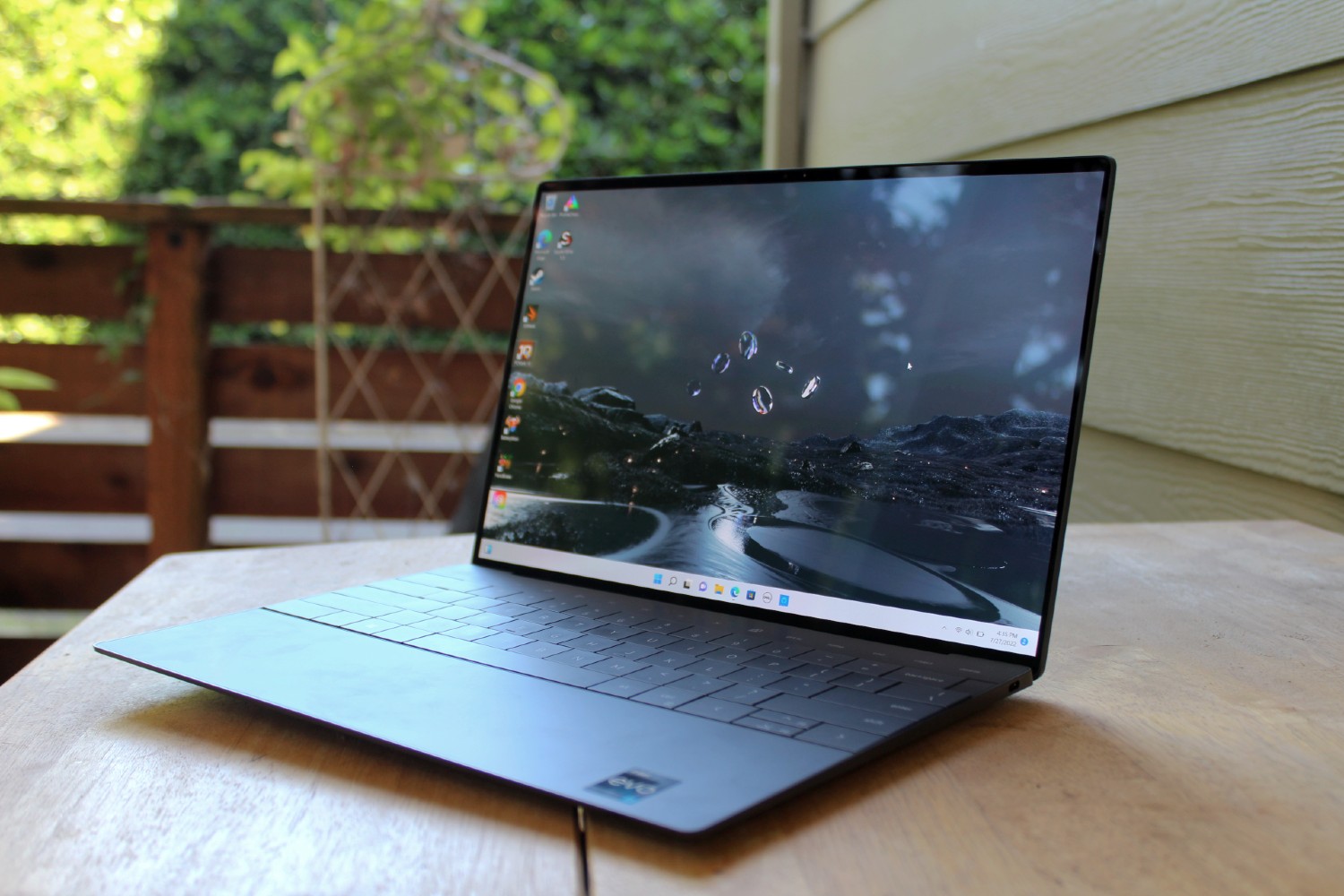 The Dell XPS 13 Plus on a table outside.